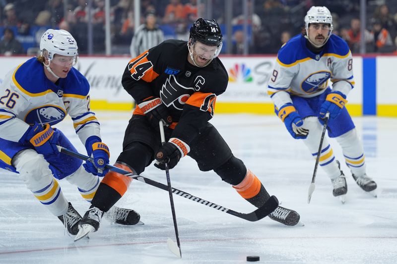 Nov 16, 2024; Philadelphia, Pennsylvania, USA; Philadelphia Flyers center Sean Couturier (14) and Buffalo Sabres defenseman Rasmus Dahlin (26) battle for the puck in the third period at Wells Fargo Center. Mandatory Credit: Kyle Ross-Imagn Images