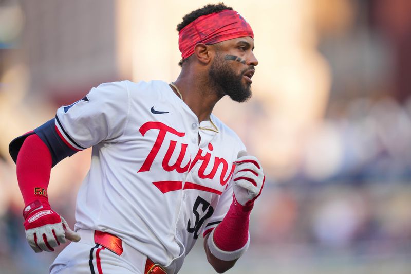 Aug 12, 2024; Minneapolis, Minnesota, USA; Minnesota Twins shortstop Willi Castro (50) celebrates his home run against the Kansas City Royals in the second inning at Target Field. Mandatory Credit: Brad Rempel-USA TODAY Sports