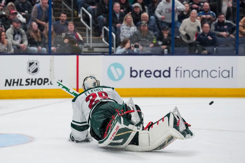 Jan 6, 2024; Columbus, Ohio, USA;  Minnesota Wild goaltender Marc-Andre Fleury (29) dives to attempt a save against the Columbus Blue Jackets in the third period at Nationwide Arena. Mandatory Credit: Aaron Doster-USA TODAY Sports