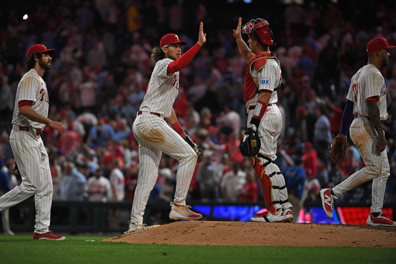 May 27, 2025; Philadelphia, Pennsylvania, USA; Philadelphia Phillies third base Alec Bohm (28) and catcher J.T. Realmuto (10) celebrate win against the Atlanta Braves at Citizens Bank Park. Mandatory Credit: Eric Hartline-Imagn Images