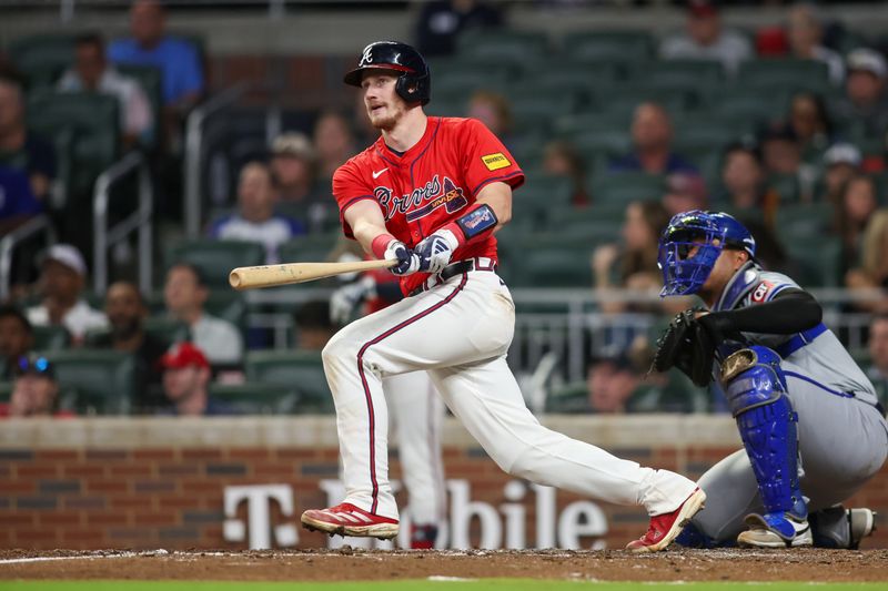 Sep 27, 2024; Atlanta, Georgia, USA; Atlanta Braves catcher Sean Murphy (12) hits a two-run home run against the Kansas City Royals in the fourth inning at Truist Park. Mandatory Credit: Brett Davis-Imagn Images