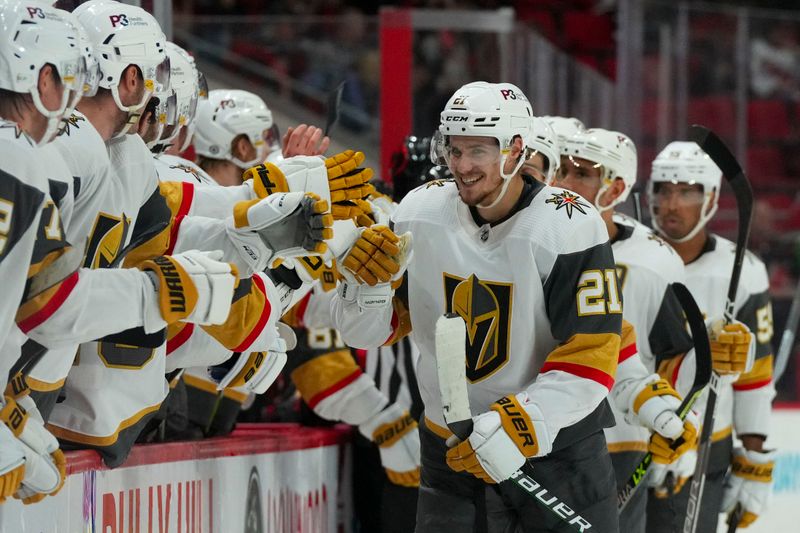 Mar 11, 2023; Raleigh, North Carolina, USA; Vegas Golden Knights center Brett Howden (21) is congratulated after his goal against the Carolina Hurricanes during the third period at PNC Arena. Mandatory Credit: James Guillory-USA TODAY Sports