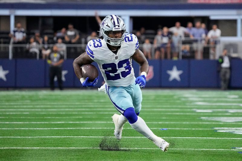 Dallas Cowboys running back Rico Dowdle runs with the ball during the first half of an NFL preseason football game against the Jacksonville Jaguars, Saturday, Aug. 12, 2023, in Arlington, Texas. (AP Photo/Sam Hodde)