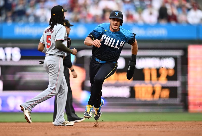May 17, 2024; Philadelphia, Pennsylvania, USA; Philadelphia Phillies catcher J.T. Realmuto (10) advances to third and scores against the Washington Nationals in the first inning at Citizens Bank Park. Mandatory Credit: Kyle Ross-USA TODAY Sports