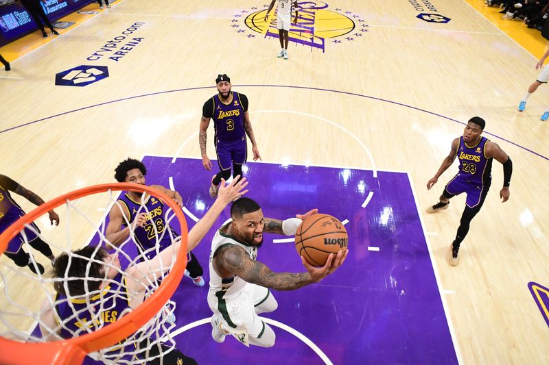 LOS ANGELES, CA - MARCH 8: Damian Lillard #0 of the Milwaukee Bucks drives to the basket during the game against the Los Angeles Lakers on March 8, 2024 at Crypto.Com Arena in Los Angeles, California. NOTE TO USER: User expressly acknowledges and agrees that, by downloading and/or using this Photograph, user is consenting to the terms and conditions of the Getty Images License Agreement. Mandatory Copyright Notice: Copyright 2024 NBAE (Photo by Adam Pantozzi/NBAE via Getty Images)