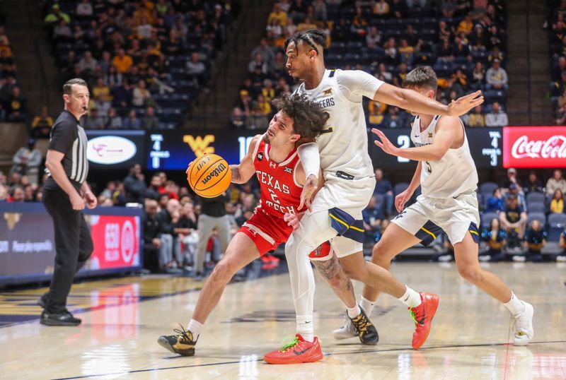 Mar 2, 2024; Morgantown, West Virginia, USA; Texas Tech Red Raiders guard Pop Isaacs (2) and West Virginia Mountaineers forward Josiah Harris (22) collide during a play in the first half at WVU Coliseum. Mandatory Credit: Ben Queen-USA TODAY Sports