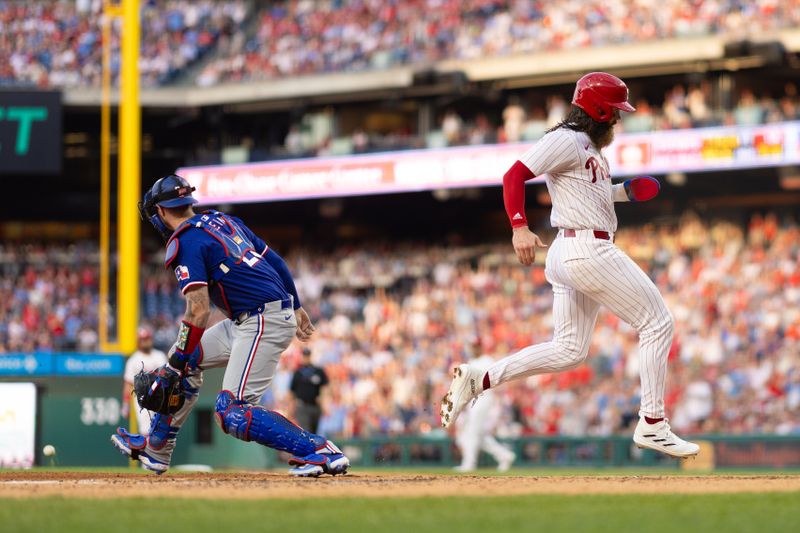 May 21, 2024; Philadelphia, Pennsylvania, USA; Philadelphia Phillies outfielder Brandon Marsh (16) scores past Texas Rangers catcher Jonah Heim (28) during the third inning at Citizens Bank Park. Mandatory Credit: Bill Streicher-USA TODAY Sports