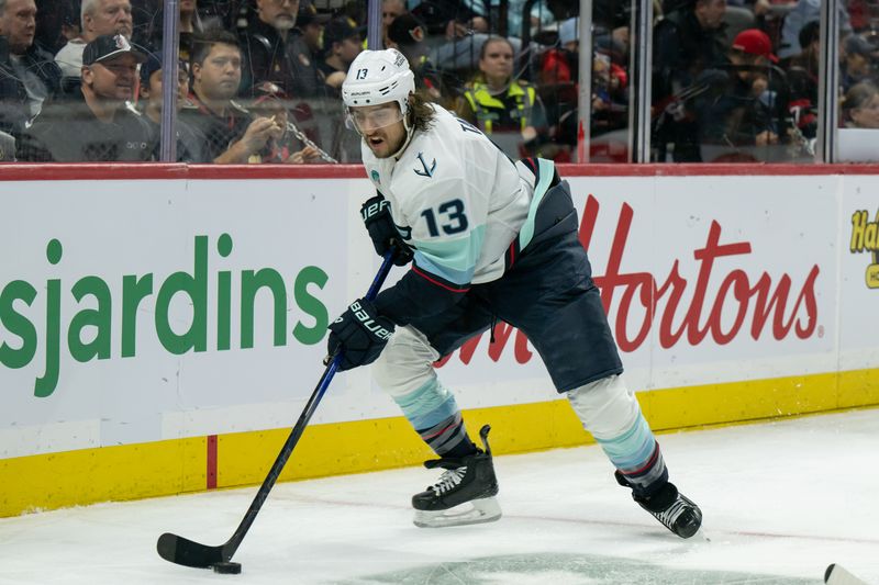 Nov 2, 2024; Ottawa, Ontario, CAN; Seattle Kraken left wing Brandon Tanev (13) skates with the puck in the second period against the Ottawa Senators at the Canadian Tire Centre. Mandatory Credit: Marc DesRosiers-Imagn Images