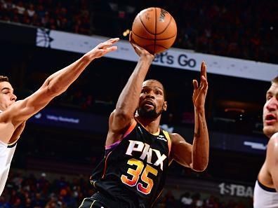 PHOENIX, AZ - DECEMBER 1: Kevin Durant #35 of the Phoenix Suns shoots the ball during the game against the Denver Nuggets on December 1, 2023 at Footprint Center in Phoenix, Arizona. NOTE TO USER: User expressly acknowledges and agrees that, by downloading and or using this photograph, user is consenting to the terms and conditions of the Getty Images License Agreement. Mandatory Copyright Notice: Copyright 2023 NBAE (Photo by Barry Gossage/NBAE via Getty Images)