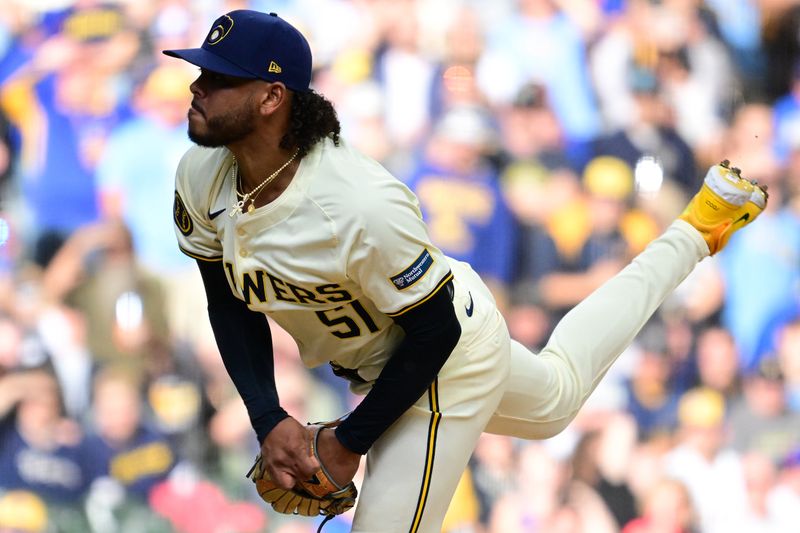 Oct 1, 2024; Milwaukee, Wisconsin, USA; Milwaukee Brewers pitcher Freddy Peralta (51) throws a pitch during the first inning in game one of the Wildcard round for the 2024 MLB Playoffs at American Family Field. Mandatory Credit: Benny Sieu-Imagn Images