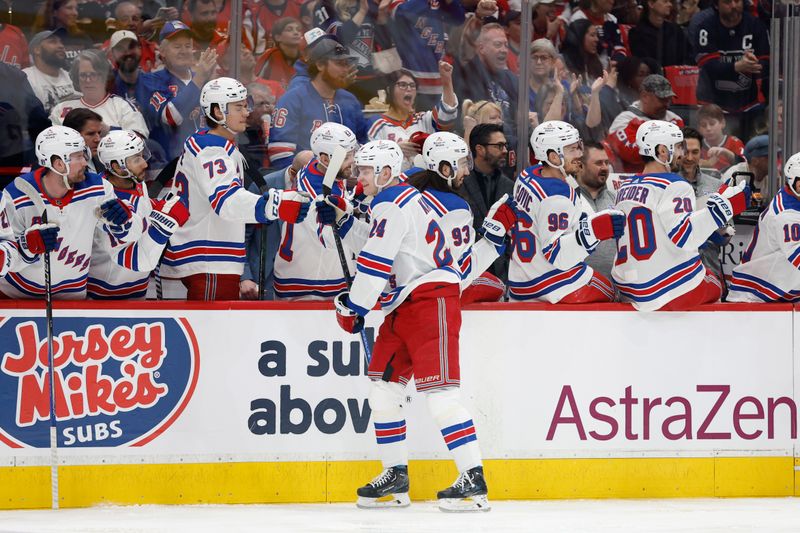 Apr 28, 2024; Washington, District of Columbia, USA; New York Rangers right wing Kaapo Kakko (24) celebrates with teammates after scoring a goal against the Washington Capitals in the first period in game four of the first round of the 2024 Stanley Cup Playoffs at Capital One Arena. Mandatory Credit: Geoff Burke-USA TODAY Sports