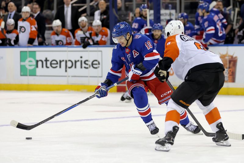 Dec 20, 2025; New York, New York, USA; New York Rangers left wing Artemi Panarin (10) skates with the puck against Philadelphia Flyers defenseman Jamie Drysdale (9) during overtime at Madison Square Garden. Mandatory Credit: Brad Penner-Imagn Images