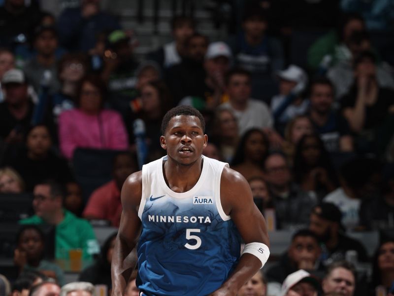 MINNEAPOLIS, MN -  APRIL 12:  Anthony Edwards #5 of the Minnesota Timberwolves looks on during the game against the Atlanta Hawks on April 12, 2024 at Target Center in Minneapolis, Minnesota. NOTE TO USER: User expressly acknowledges and agrees that, by downloading and or using this Photograph, user is consenting to the terms and conditions of the Getty Images License Agreement. Mandatory Copyright Notice: Copyright 2024 NBAE (Photo by David Sherman/NBAE via Getty Images)