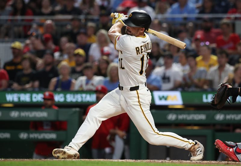 Jun 30, 2025; Pittsburgh, Pennsylvania, USA;  Pittsburgh Pirates right fielder Bryan Reynolds (10) hits a single against the St. Louis Cardinals during the fifth inning at PNC Park. Mandatory Credit: Charles LeClaire-Imagn Images