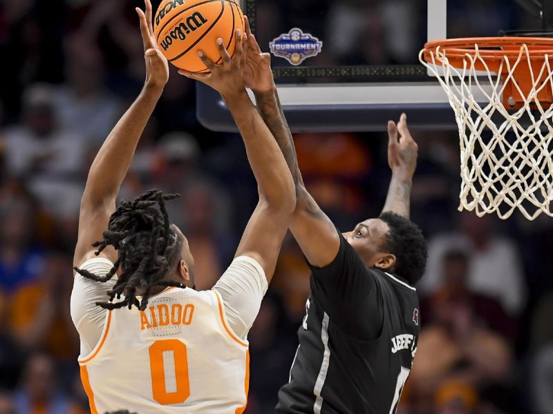 Mar 15, 2024; Nashville, TN, USA; Mississippi State Bulldogs forward D.J. Jeffries (0) blocks the shot of Tennessee Volunteers forward Jonas Aidoo (0) during the first half at Bridgestone Arena. Mandatory Credit: Steve Roberts-USA TODAY Sports