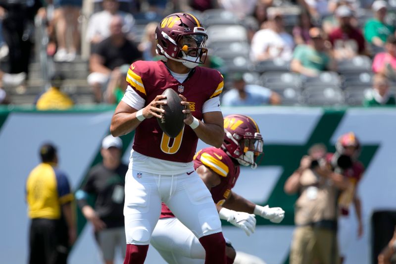 Washington Commanders quarterback Marcus Mariota drops back to pass during the first half of an NFL preseason football game against the New York Jets Saturday, Aug. 10, 2024, in East Rutherford. N.J. (AP Photo/Pamela Smith)