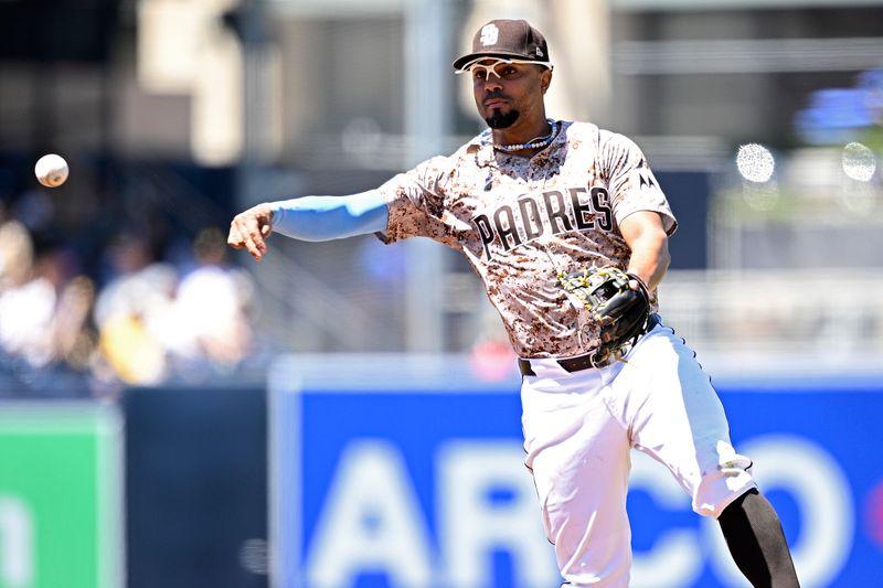 Aug 25, 2024; San Diego, California, USA; San Diego Padres second baseman Xander Bogaerts (2) throws to first base during the third inning against the New York Mets at Petco Park. Mandatory Credit: Orlando Ramirez-USA TODAY Sports