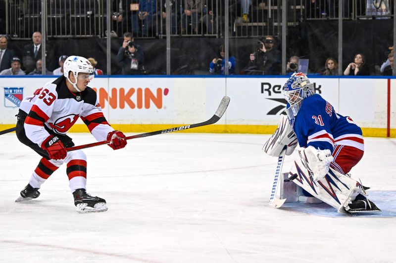 Dec 2, 2024; New York, New York, USA; New Jersey Devils left wing Jesper Bratt (63) shoots wide on New York Rangers goaltender Igor Shesterkin (31) during the first period  at Madison Square Garden. Mandatory Credit: Dennis Schneidler-Imagn Images