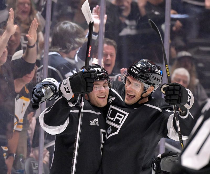 Oct 21, 2023; Los Angeles, California, USA: Los Angeles Kings right wing Alex Laferriere (78) celebrates with defenseman Andreas Englund (5) after scoring against the Boston Bruins during the second period at Crypto.com Arena. Mandatory Credit: Alex Gallardo-USA TODAY Sports