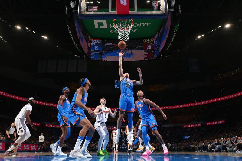 OKLAHOMA CITY, OK - JANUARY 31: Lindy Waters III #12 of the Oklahoma City Thunder drives to the basket during the game against the Denver Nuggets on January 31, 2024 at Paycom Arena in Oklahoma City, Oklahoma. NOTE TO USER: User expressly acknowledges and agrees that, by downloading and or using this photograph, User is consenting to the terms and conditions of the Getty Images License Agreement. Mandatory Copyright Notice: Copyright 2024 NBAE (Photo by Zach Beeker/NBAE via Getty Images)