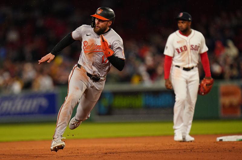 Apr 10, 2024; Boston, Massachusetts, USA; Baltimore Orioles outfielder Colton Cowser (17) to third base against the Boston Red Sox in the sixth inning at Fenway Park. Mandatory Credit: David Butler II-USA TODAY Sports