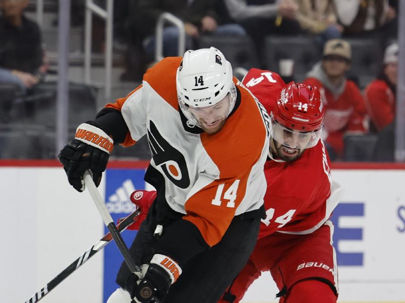 Jan 25, 2024; Detroit, Michigan, USA;  Philadelphia Flyers center Sean Couturier (14) skates with the puck chased by Detroit Red Wings center Robby Fabbri (14) in the third period at Little Caesars Arena. Mandatory Credit: Rick Osentoski-USA TODAY Sports