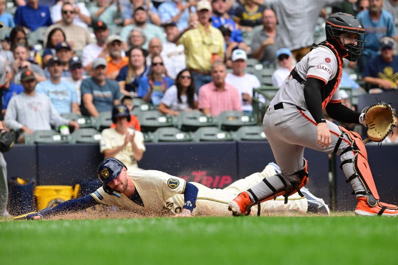 Aug 29, 2024; Milwaukee, Wisconsin, USA;  Milwaukee Brewers second baseman Brice Turang (2) scores in the fourth inning as San Francisco Giants catcher Patrick Bailey (14) looks on at American Family Field. Mandatory Credit: Benny Sieu-USA TODAY Sports