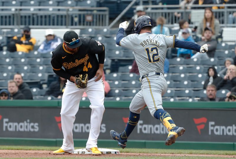 Apr 25, 2024; Pittsburgh, Pennsylvania, USA;  Milwaukee Brewers first base Rhys Hoskins (12) is safe at first base as Pittsburgh Pirates first base Rowdy Tellez (44) can not hold the bag during the seventh inning at PNC Park. The Brewers won 7-5. Mandatory Credit: Charles LeClaire-USA TODAY Sports