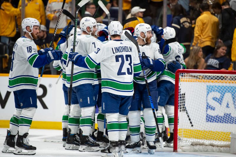 May 3, 2024; Nashville, Tennessee, USA; Vancouver Canucks celebrates the series win against the Nashville Predators during the third period in game six of the first round of the 2024 Stanley Cup Playoffs at Bridgestone Arena. Mandatory Credit: Steve Roberts-USA TODAY Sports