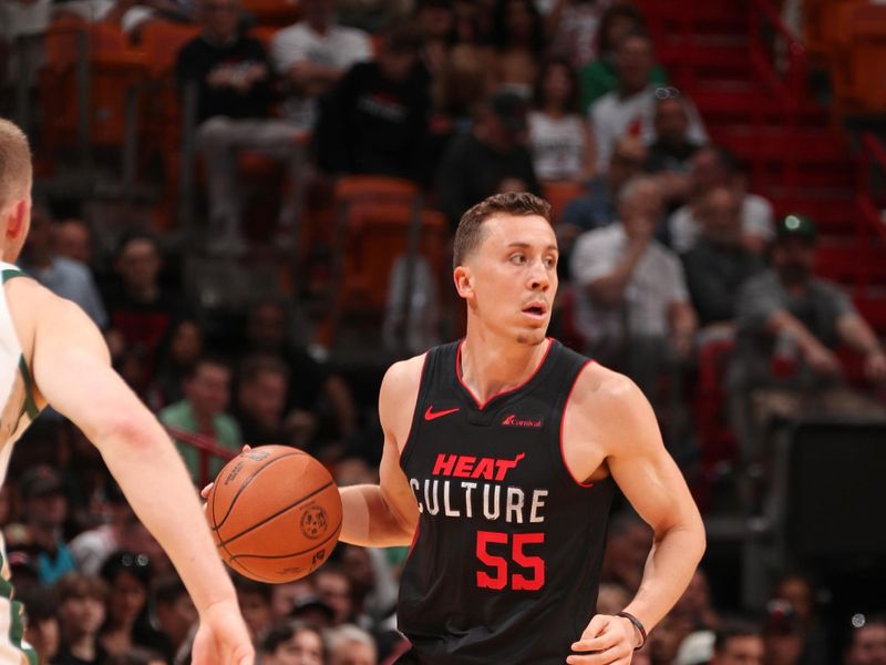 MIAMI, FL - FEBRUARY 11: Duncan Robinson #55 of the Miami Heat dribbles the ball during the game against the Boston Celtics on February 11, 2024 at Kaseya Center in Miami, Florida. NOTE TO USER: User expressly acknowledges and agrees that, by downloading and or using this Photograph, user is consenting to the terms and conditions of the Getty Images License Agreement. Mandatory Copyright Notice: Copyright 2024 NBAE (Photo by Issac Baldizon/NBAE via Getty Images)