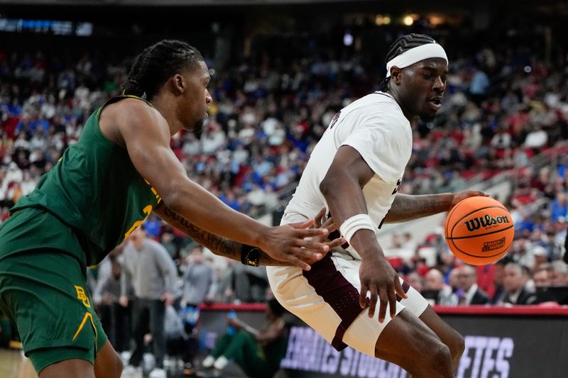 Mar 21, 2025; Raleigh, NC, USA; Mississippi State Bulldogs forward Cameron Matthews (4) dribbles the ball against Mississippi State Bulldogs guard Riley Kugel (2) during the second half in the first round of the NCAA Tournament at Lenovo Center. Mandatory Credit: Bob Donnan-Imagn Images