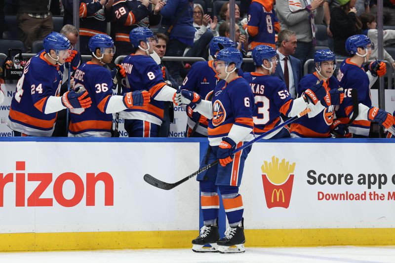 Jan 18, 2025; Elmont, New York, USA; New York Islanders defenseman Ryan Pulock (6) celebrates his goal against the San Jose Sharks during the third period at UBS Arena. Mandatory Credit: Thomas Salus-Imagn Images