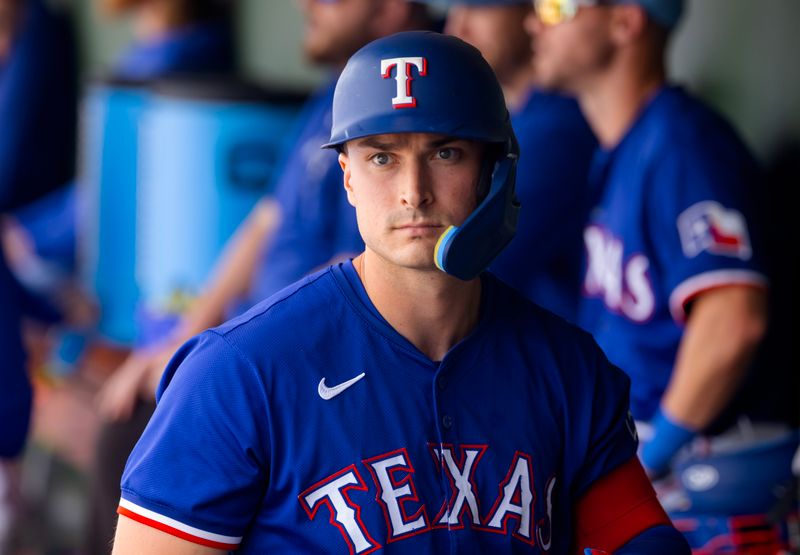 Mar 18, 2024; Surprise, Arizona, USA; Texas Rangers designated hitter Justin Foscue against the Seattle Mariners during a spring training baseball game at Surprise Stadium. Mandatory Credit: Mark J. Rebilas-USA TODAY Sports