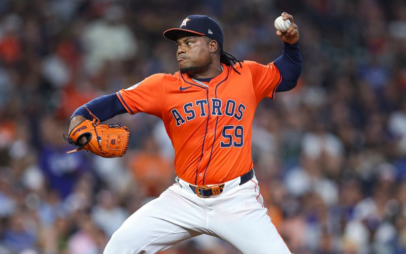 Jul 26, 2024; Houston, Texas, USA; Houston Astros starting pitcher Framber Valdez (59) delivers a pitch during the first inning against the Los Angeles Dodgers at Minute Maid Park. Mandatory Credit: Troy Taormina-USA TODAY Sports