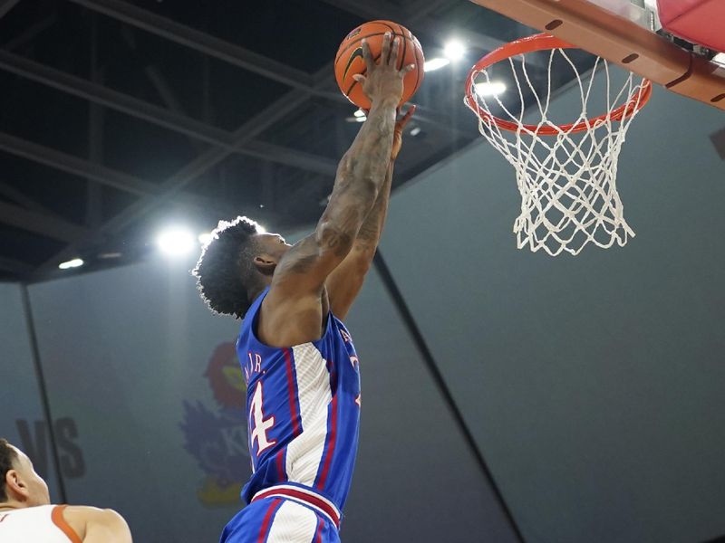 Mar 4, 2023; Austin, Texas, USA; Kansas Jayhawks forward KJ Adams Jr. (24) dunks during the second half against the Texas Longhorns at Moody Center. Mandatory Credit: Scott Wachter-USA TODAY Sports