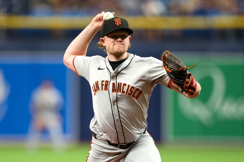 Apr 13, 2024; St. Petersburg, Florida, USA;  San Francisco Giants pitcher Logan Webb (62) throws a pitch against the Tampa Bay Rays in the second inning at Tropicana Field. Mandatory Credit: Nathan Ray Seebeck-USA TODAY Sports