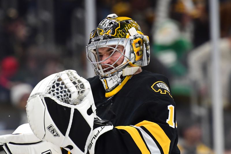 Dec 20, 2025; Boston, Massachusetts, USA; Boston Bruins goaltender Jeremy Swayman (1) puts on his gloves during the second period against the Vancouver Canucks at TD Garden. Mandatory Credit: Bob DeChiara-Imagn Images