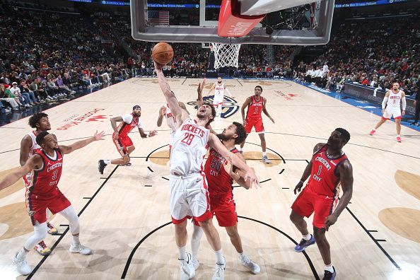 NEW ORLEANS, LA - DECEMBER 23: Alperen Sengun #28 of the Houston Rockets grabs the rebound during the game against the New Orleans Pelicans on December 23, 2023 at the Smoothie King Center in New Orleans, Louisiana. NOTE TO USER: User expressly acknowledges and agrees that, by downloading and or using this Photograph, user is consenting to the terms and conditions of the Getty Images License Agreement. Mandatory Copyright Notice: Copyright 2023 NBAE (Photo by Layne Murdoch Jr./NBAE via Getty Images)