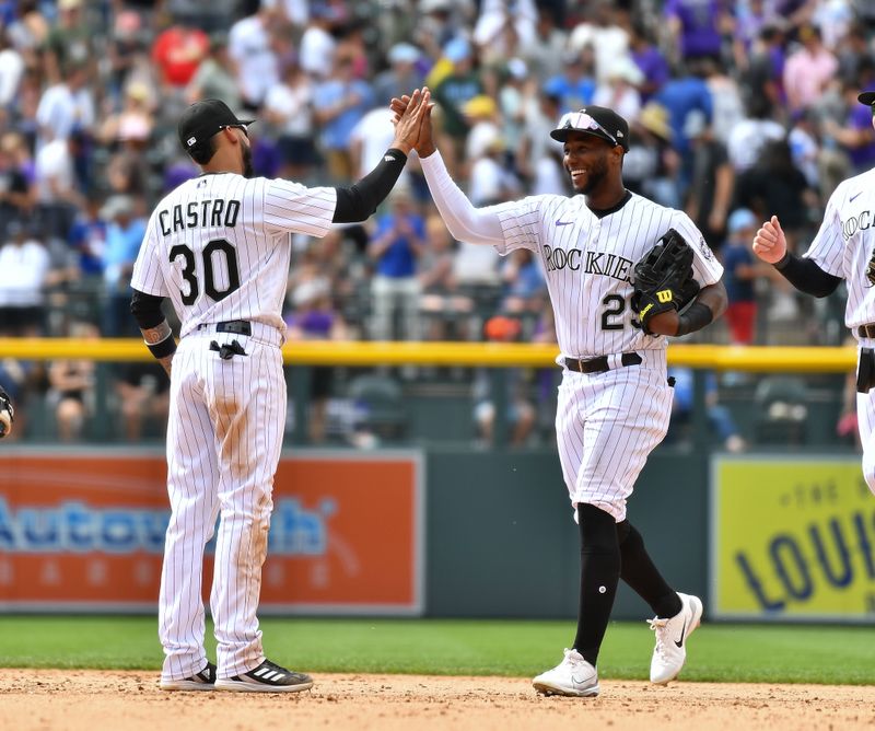 May 28, 2023; Denver, Colorado, USA;  Colorado Rockies second baseman Harold Castro (30) and Colorado Rockies left fielder Jurickson Profar (29) celebrate after the win over the New York Mets at Coors Field. Mandatory Credit: John Leyba-USA TODAY Sports