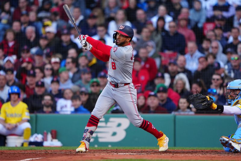 May 11, 2024; Boston, Massachusetts, USA; Washington Nationals left fielder Eddie Rosario (8) hits a home run against the Boston Red Sox during the fifth inning at Fenway Park. Mandatory Credit: Gregory Fisher-USA TODAY Sports