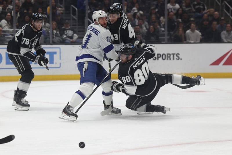 Mar 23, 2024; Los Angeles, California, USA; Tampa Bay Lighting center Luke Glendening (11) checks Los Angeles Kings Center Pierre-Luc Dubois (80) during the first period of an NHL hockey game at Crypto.com Arena. Mandatory Credit: Yannick Peterhans-USA TODAY Sports