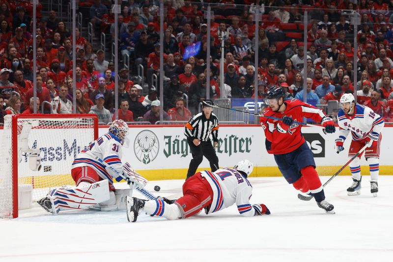 Apr 28, 2024; Washington, District of Columbia, USA; New York Rangers goaltender Igor Shesterkin (31) makes a save on Washington Capitals right wing Nicolas Aube-Kubel (96) in the first period in game four of the first round of the 2024 Stanley Cup Playoffs at Capital One Arena. Mandatory Credit: Geoff Burke-USA TODAY Sports