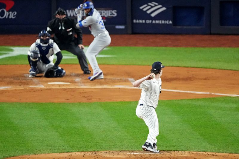 Oct 30, 2024; New York, New York, USA; New York Yankees pitcher Gerrit Cole (45) pitches during the second inning against the Los Angeles Dodgers in game four of the 2024 MLB World Series at Yankee Stadium. Mandatory Credit: Robert Deutsch-Imagn Images