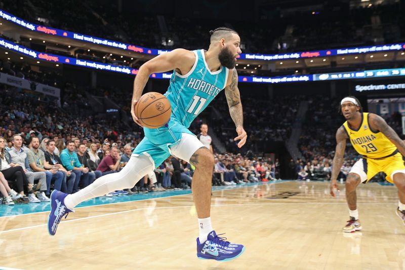 CHARLOTTE, NC - NOVEMBER 8: Cody Martin #11 of the Charlotte Hornets dribbles the ball during the game against the Indiana Pacers on November 8, 2024 at Spectrum Center in Charlotte, North Carolina. NOTE TO USER: User expressly acknowledges and agrees that, by downloading and or using this photograph, User is consenting to the terms and conditions of the Getty Images License Agreement. Mandatory Copyright Notice: Copyright 2024 NBAE (Photo by Brock Williams-Smith/NBAE via Getty Images)