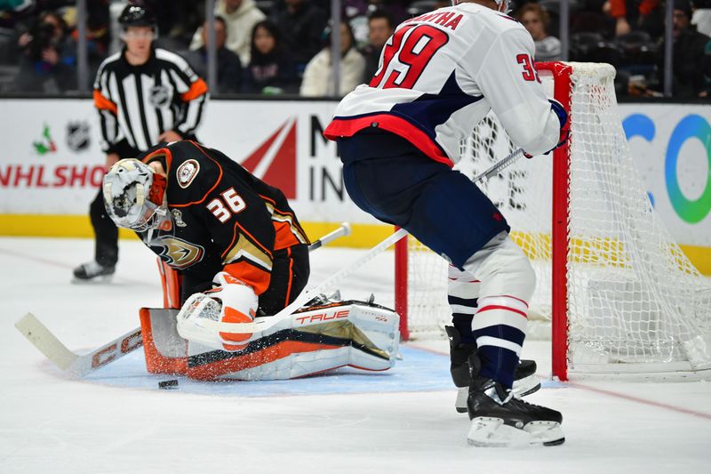 Nov 30, 2023; Anaheim, California, USA; Anaheim Ducks goaltender John Gibson (36) blocks a shot against Washington Capitals right wing Anthony Mantha (39) during the third period at Honda Center. Mandatory Credit: Gary A. Vasquez-USA TODAY Sports