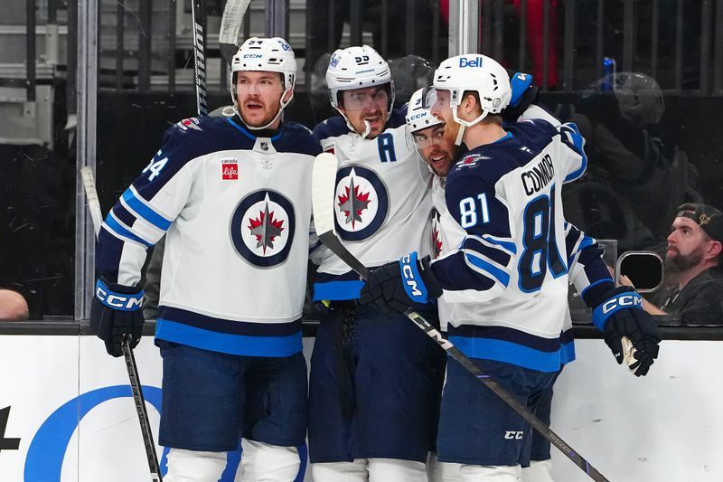 Apr 3, 2025; Las Vegas, Nevada, USA; Winnipeg Jets center Mark Scheifele (55) celebrates with team mates after scoring a goal against the Vegas Golden Knights during the first period at T-Mobile Arena. Mandatory Credit: Stephen R. Sylvanie-Imagn Images