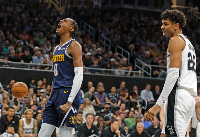 AUSTIN, TX - MARCH 15: Peyton Watson #8 of the Denver Nuggets reacts after he was fouled by Malaki Branham #22 of the San Antonio Spurs in the second half at Moody Center on March 15, 2024 in Austin, Texas. NOTE TO USER: User expressly acknowledges and agrees that, by downloading and or using this photograph, User is consenting to terms and conditions of the Getty Images License Agreement. (Photo by Ronald Cortes/Getty Images)