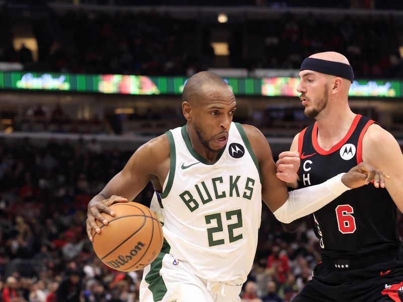 CHICAGO, ILLINOIS - NOVEMBER 30: Khris Middleton #22 of the Milwaukee Bucks drives to the basket while defended by Alex Caruso #6 of the Chicago Bulls during the second half at the United Center on November 30, 2023 in Chicago, Illinois. NOTE TO USER: User expressly acknowledges and agrees that, by downloading and or using this photograph, User is consenting to the terms and conditions of the Getty Images License Agreement. (Photo by Justin Casterline/Getty Images)