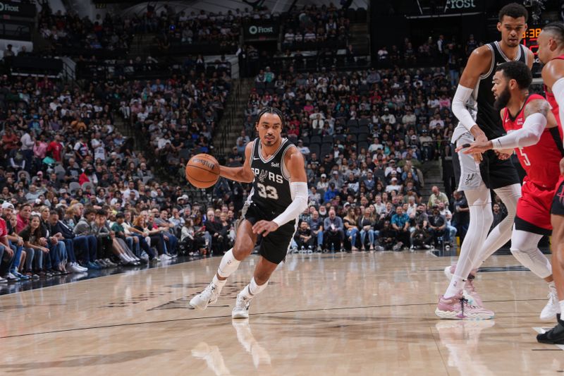 SAN ANTONIO, TX - MARCH 12: Tre Jones #33 of the San Antonio Spurs dribbles the ball during the game against the Houston Rockets on March 12, 2024 at the Frost Bank Center in San Antonio, Texas. NOTE TO USER: User expressly acknowledges and agrees that, by downloading and or using this photograph, user is consenting to the terms and conditions of the Getty Images License Agreement. Mandatory Copyright Notice: Copyright 2024 NBAE (Photos by Jesse D. Garrabrant/NBAE via Getty Images)