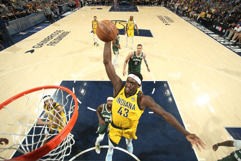 INDIANAPOLIS, IN - APRIL 28: Pascal Siakam #43 of the Indiana Pacers drives to the basket during the game against the Milwaukee Bucks during Round 1 Game 4 of the 2024 NBA Playoffs on April 28, 2024 at Gainbridge Fieldhouse in Indianapolis, Indiana. NOTE TO USER: User expressly acknowledges and agrees that, by downloading and or using this Photograph, user is consenting to the terms and conditions of the Getty Images License Agreement. Mandatory Copyright Notice: Copyright 2024 NBAE (Photo by Nathaniel S. Butler/NBAE via Getty Images)